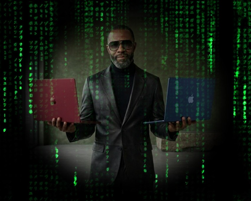 Un hombre con un aire a Morfeo de Matrix nos ofrece dos MacBook Neo en color rojo o azul, ¿cuál eliges? ;)